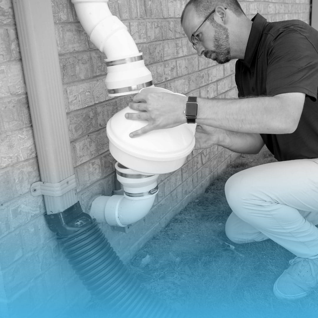 Technician Installing Radon Mitigation System